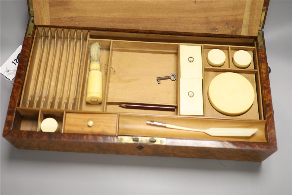 A fine quality 19th century amboyna toilet box / writing slope, length 45cm